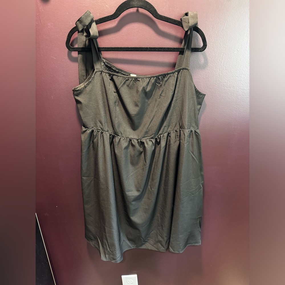 NWOT black mini dress with pockets and ties